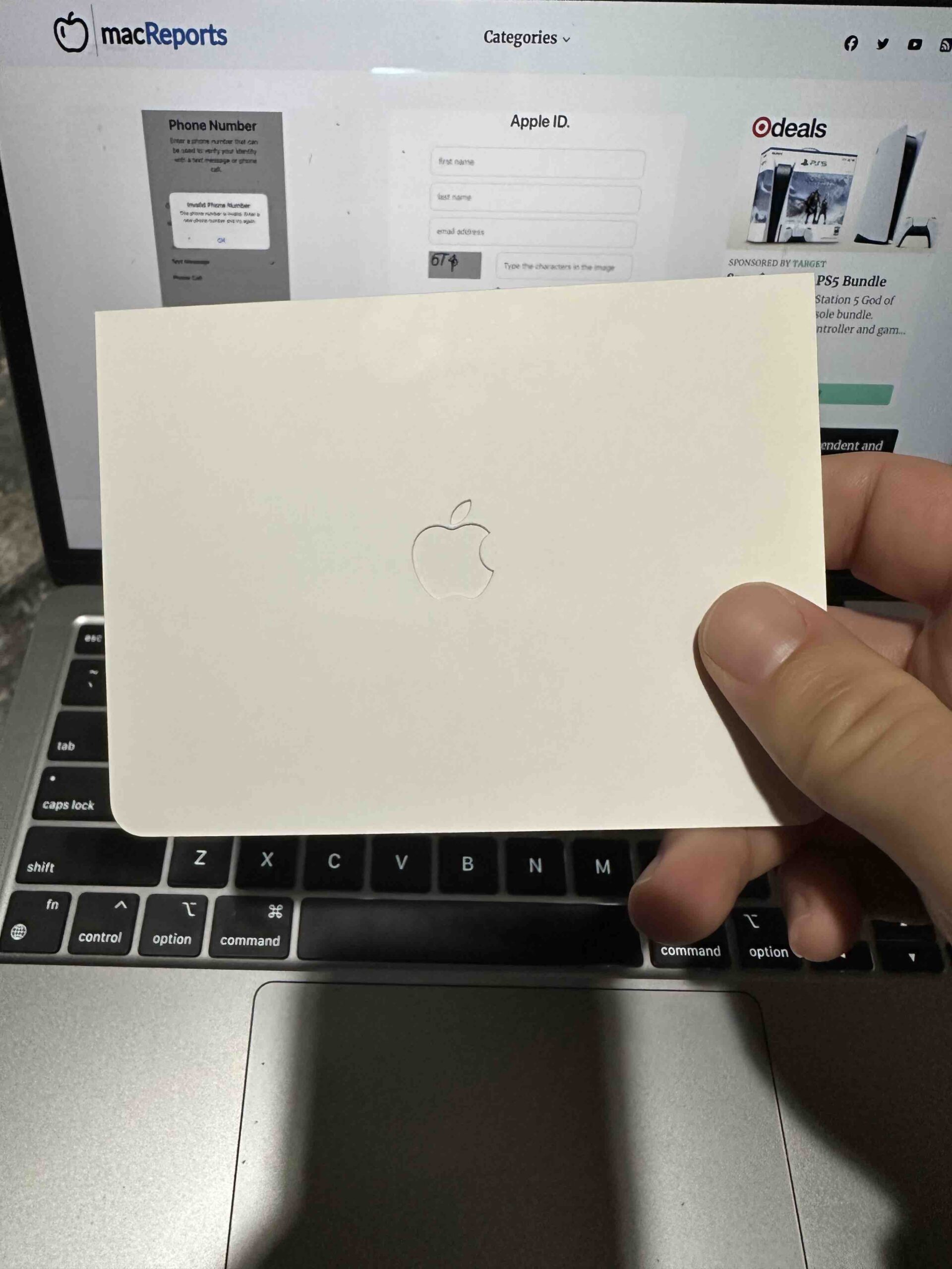 A photo of a titanium Apple Card in its white card