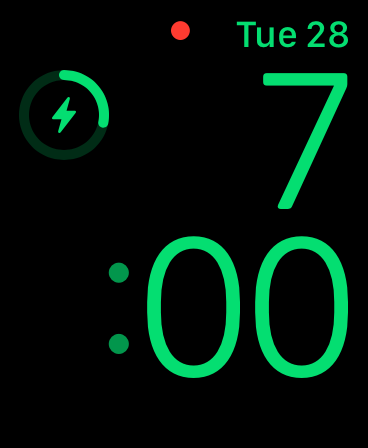 Apple Watch charging screen showing a green lightning bolt