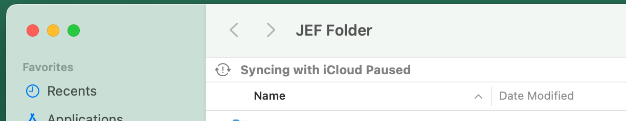 syncing with iCloud paused message in finder on Mac